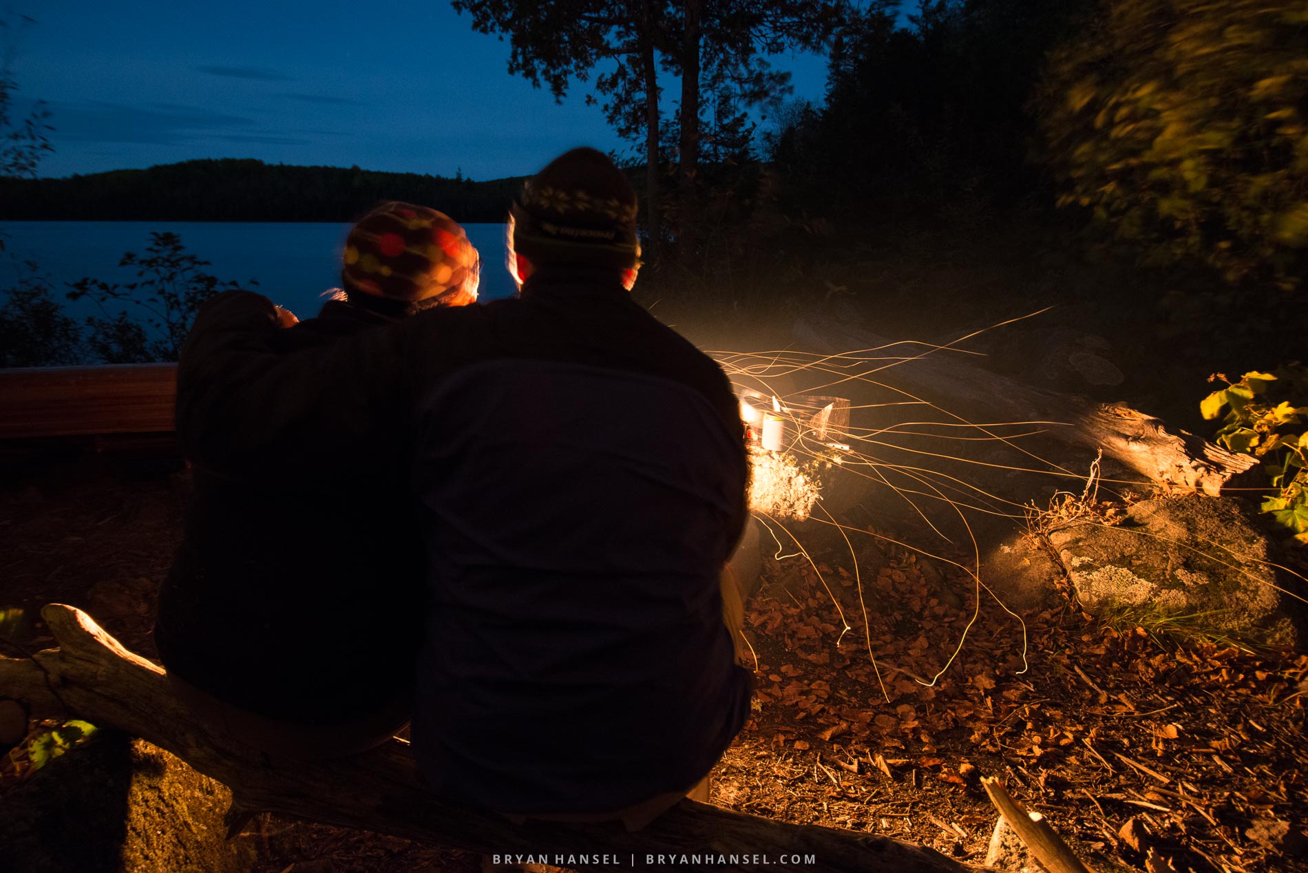 Paddlers enjoy a fire on a cold night on the Twin Lakes Canoe Route, Minnesota.