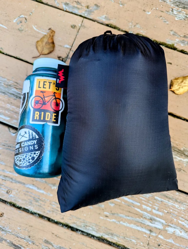 stuff sack next to a Nalgene bottle