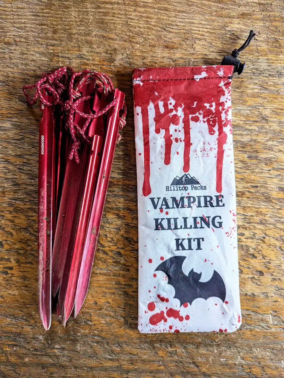A tent stake bag that has a graphic of Vampire Killing Kit next to MSR Groundhog stakes